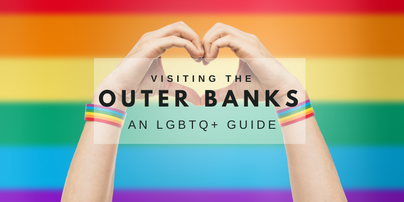 Hands formed into a heart in front of a rainbow flag and the text 'Visiting the Outer Banks: An LGBTQ+ Guide'