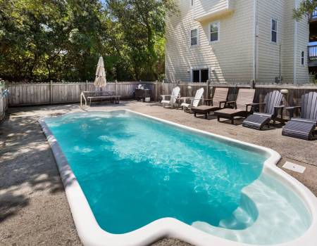 Relaxing pool beside a beach house in Corolla