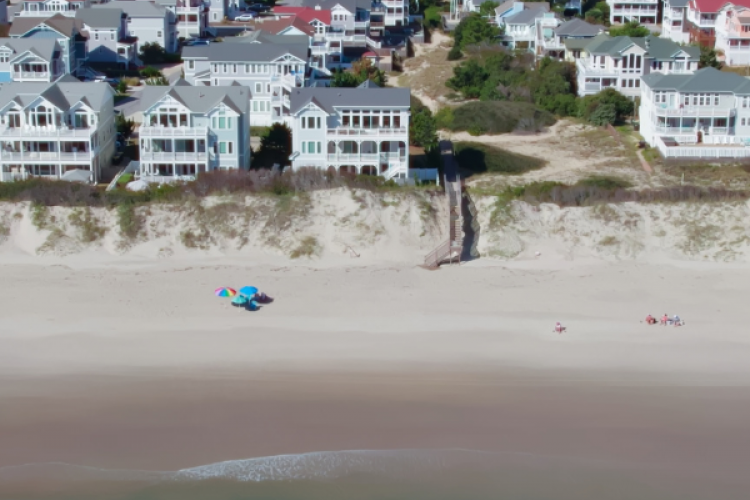 Overhead view of the vacation rental houses on the Outer Banks shoreline.
