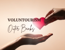 Tan background with hand placing heart in another hand.