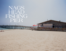 Nags Head Fishing Pier text overlay photo of the pier.