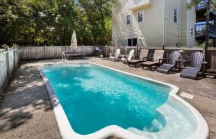 Relaxing pool beside a beach house in Corolla