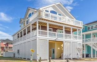 Sunflower Siesta is a cheery beach home just a 3-minute walk to the beach!