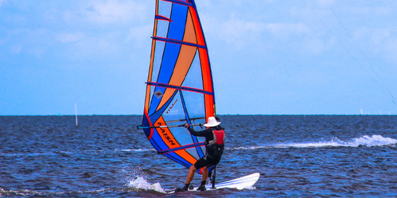Image of man kiteboarding on the Sound