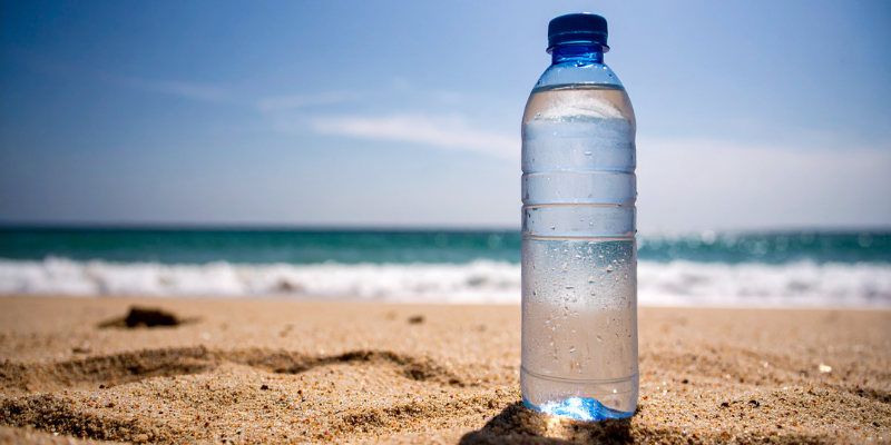 Water bottle on the beach