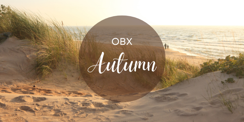 Sunset beach background with text OBX Autumn