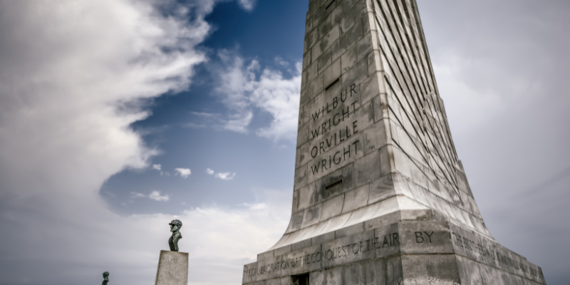 Image of Wright Brothers Memorial against blue sky