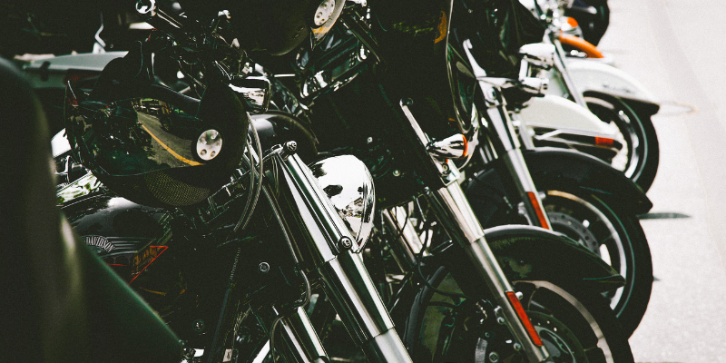 Image shows sideview of various types of motorcycles.