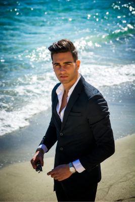 Formal Beach Wedding Attire for Men and Masculine Presenting; Man wearing a suit on the beach.